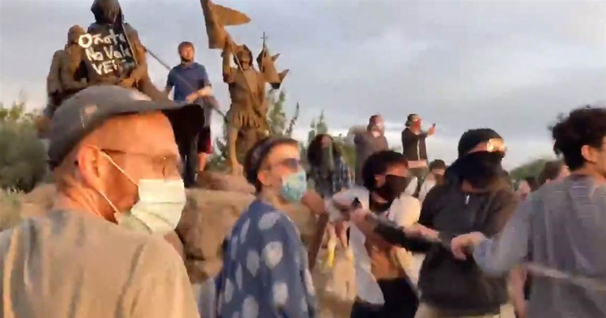 Gunshots appear to sound at demonstration over conquistador statue