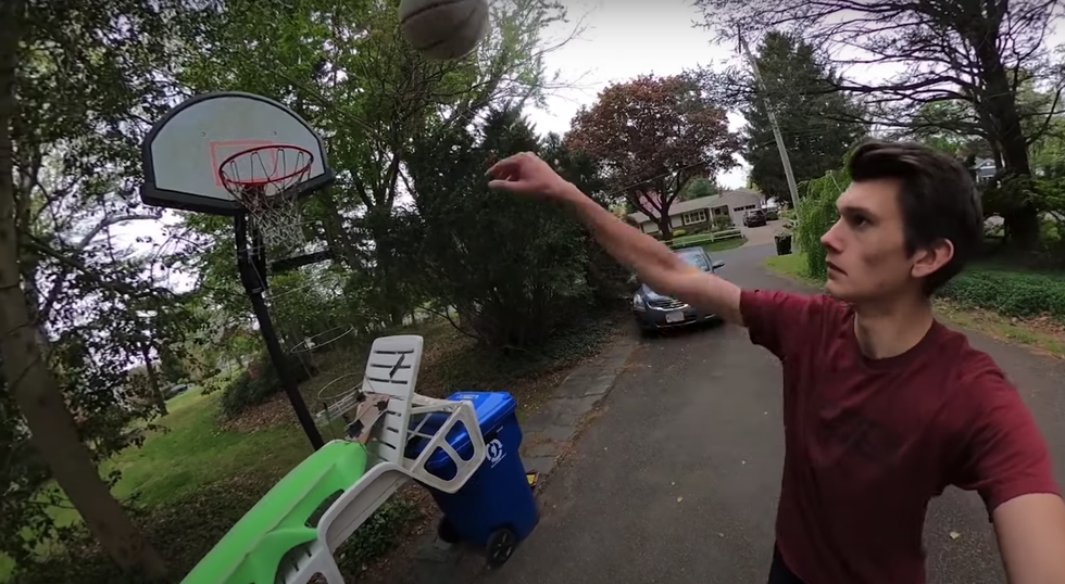 This Guy Spent 2 Months Atmosphere Up the World’s Longest Trick Shot in His Yard