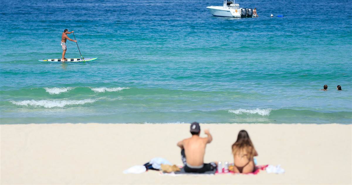 Florida counties fight coronavirus surge by closing beaches, mailing out masks