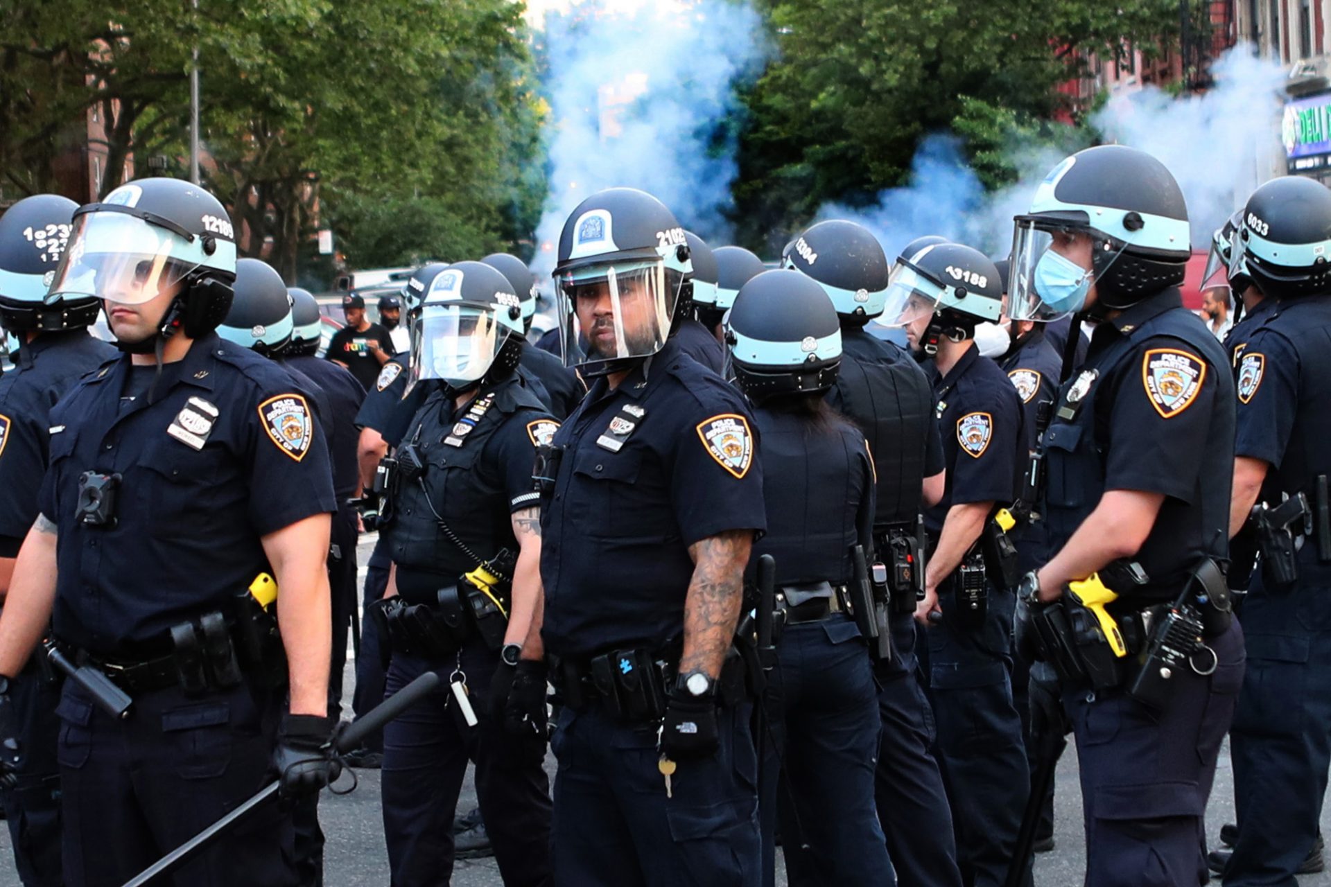 Offended mob hurls bottles at NYPD cruisers one day of standoff in Harlem