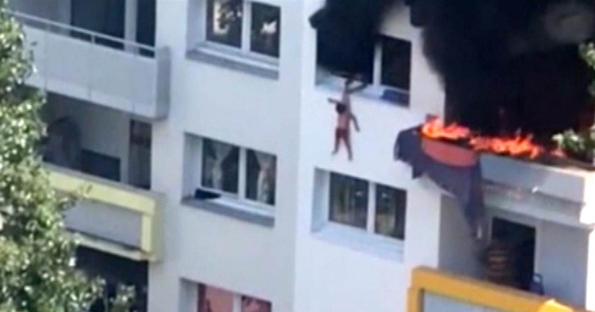 Children drop from window to run burning home