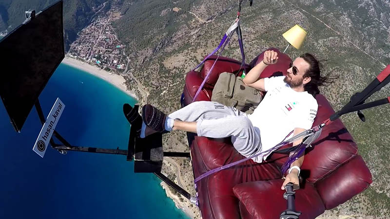 Couch potato goes parasailing with his couch and TV