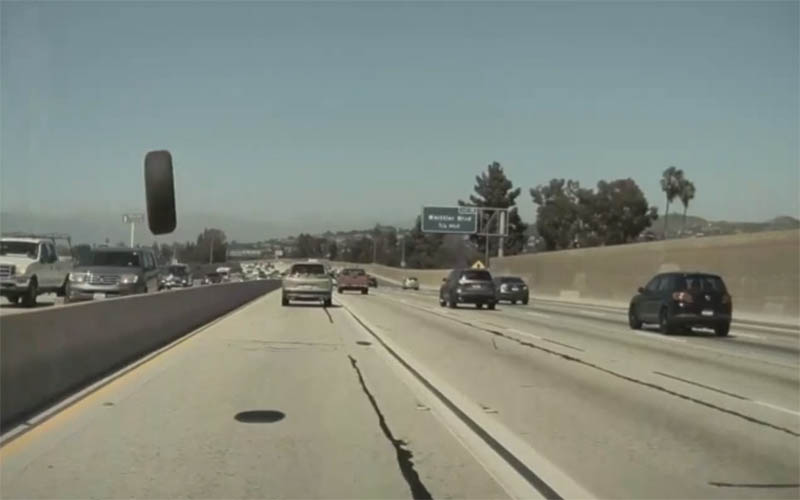 Tesla Mannequin 3 narrowly avoids flying tire