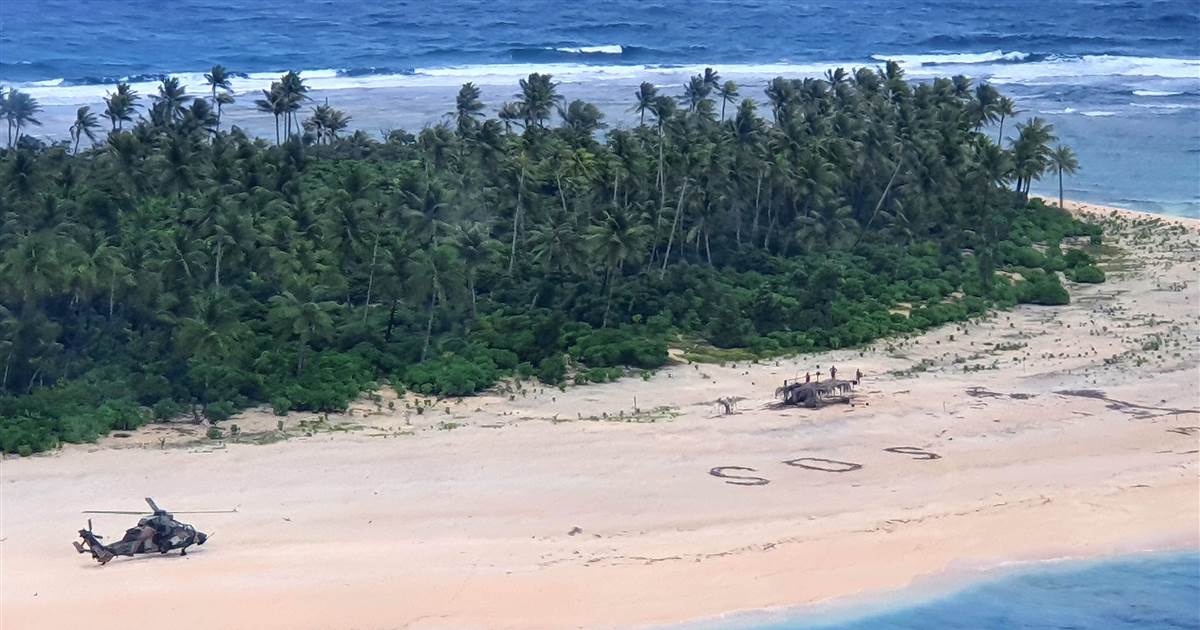 Males rescued from deserted Pacific island after writing SOS in sand