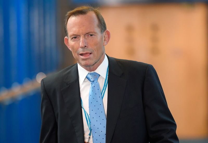 Britain names damaged-down Australian PM Abbott as alternate adviser