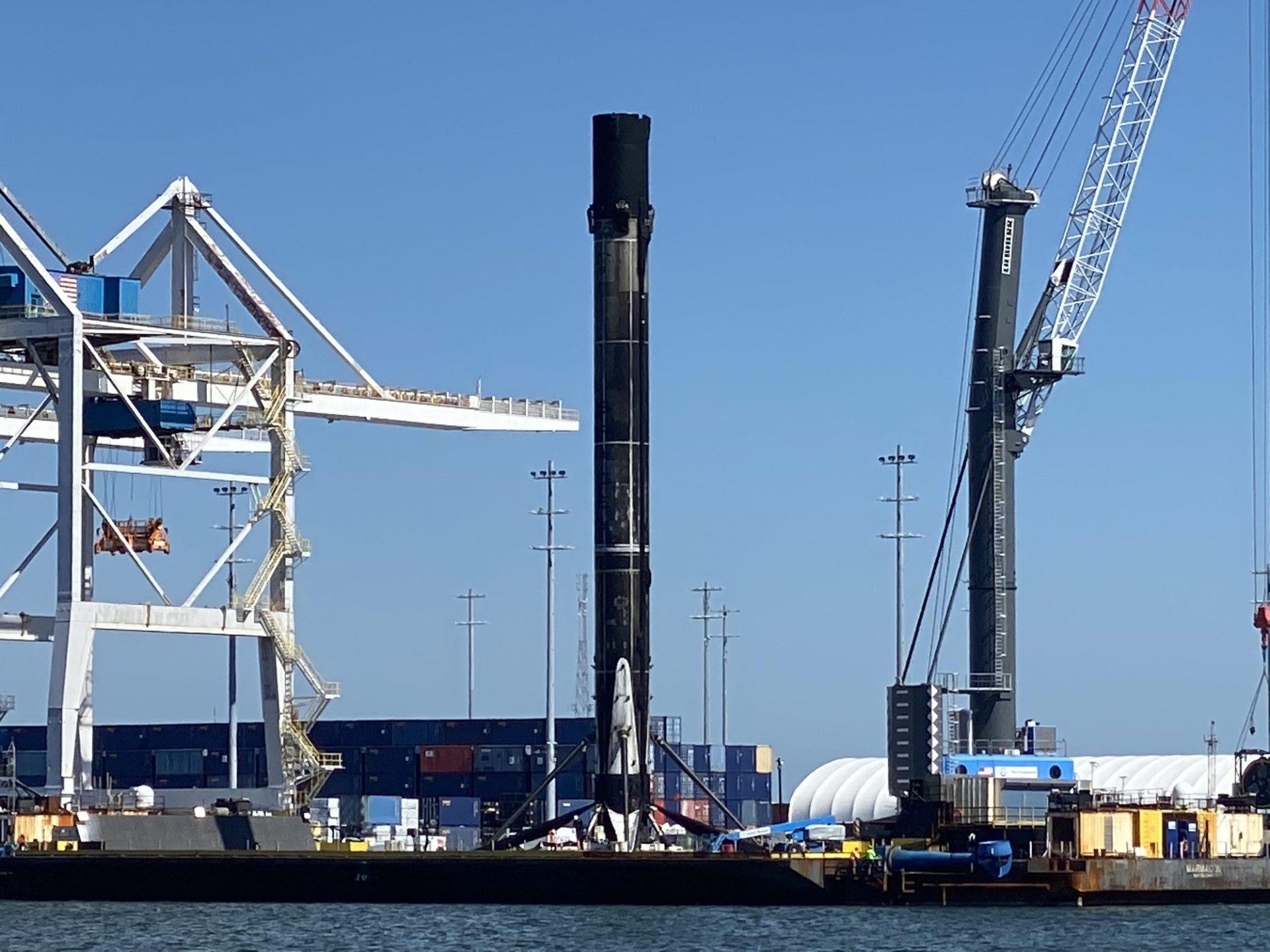 Search for SpaceX’s most-flown rocket returns to dwelling port after ninth flight (photos)