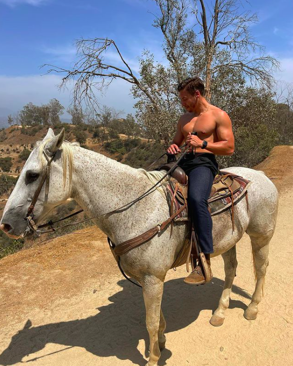 Arnold’s Son Joseph Baena Shows Off His Action Hero Physique While Using Horseback